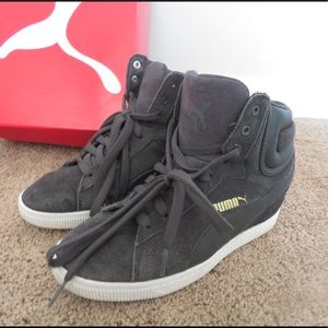 Grey Puma wedge sneakers.